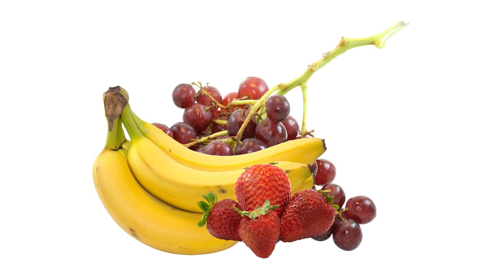Bananas, strawberries and red grapes on a white background